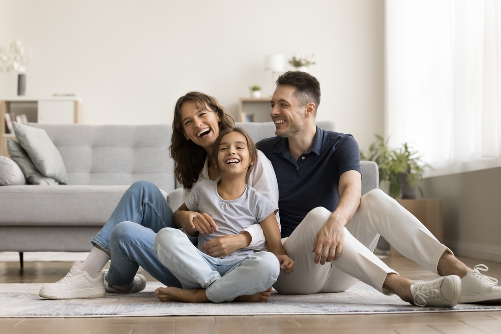 Happy,Hispanic,Family,With,Cheery,Cute,Daughter,Relaxing,Seated,On